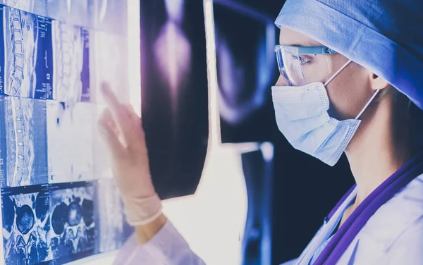 Two female women medical doctors looking at x-rays in a hospital. — Stock Photo, Image