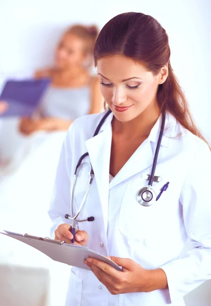 Woman doctor standing at hospital Stock Image
