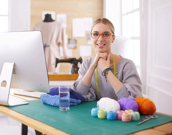 Young entrepreneur women, and fashion designer working on her atelier