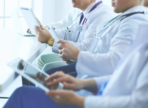 Medical team sitting and discussing at table — Stock Photo, Image