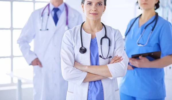 Group of doctors and nurses standing in the hospital room — Stock Photo, Image