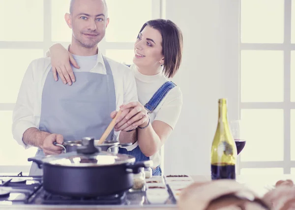 Couple cooking together in the kitchen at home — Stock Photo, Image