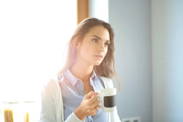 https://st3.depositphotos.com/3200101/i/600/depositphotos_170605620-stock-photo-happy-woman-drinking-tea-in.jpg