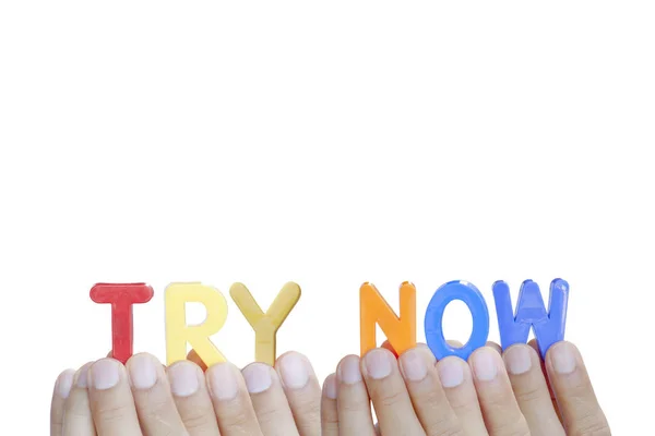 Man fingers showing "TRY NOW" text on white background — Stock Photo, Image