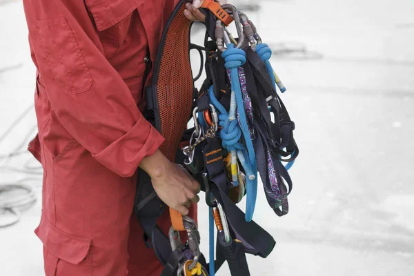 Inspector showing rope access equipment