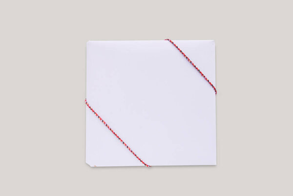 Box template with red ropes. Isolated wrapped gift