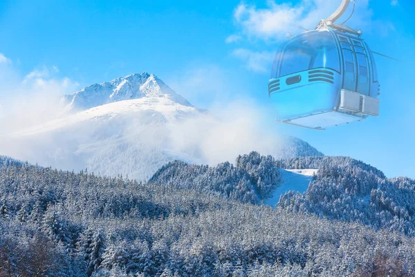 travel ski background with cable car cabin, slopes, snow mountain peak, copyspace