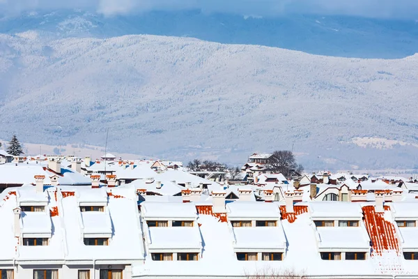 Houses with snow roofs panorama in bulgarian ski resort Bansko