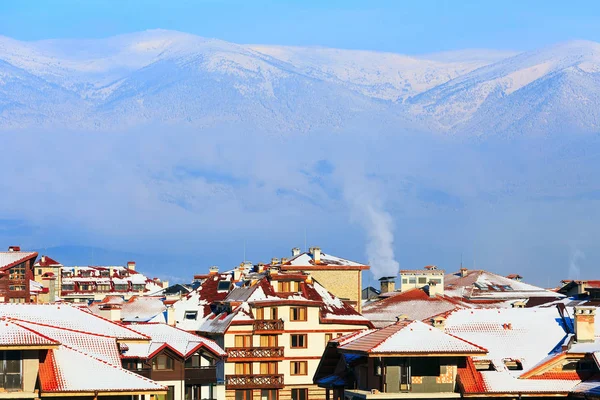 Houses, snow mountains, morning smog in Bansko, Bulgaria