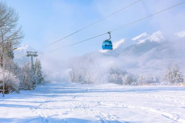 Ski resort Bansko, Bulgaria, cable car and slope clipart