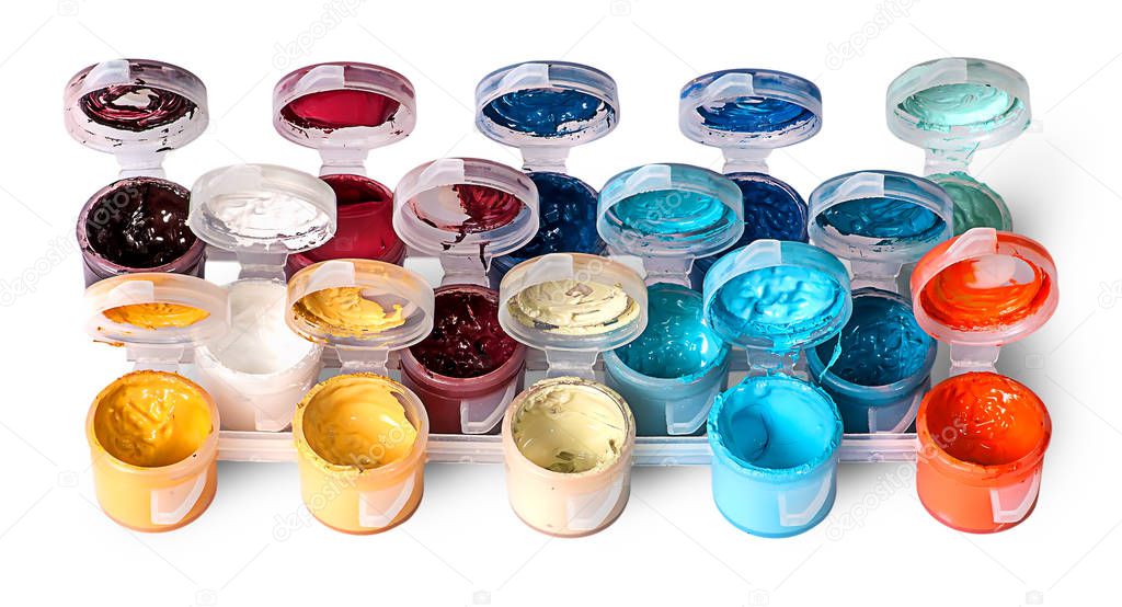 Set of colorful acrylic paints in open jars