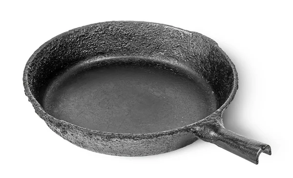 Empty old cast iron frying pan rotated — Stock Photo, Image