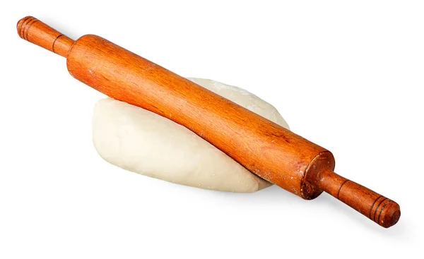 Rolling pin on a piece of dough — Stock Photo, Image