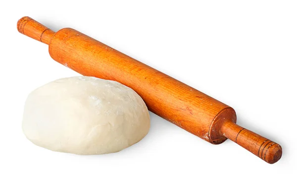 Piece of dough beside rolling pin — Stock Photo, Image