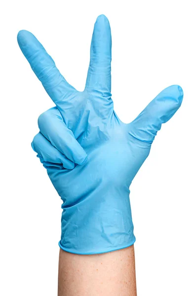 Mão em luva de látex azul mostrando três dedos verticalmente — Fotografia de Stock