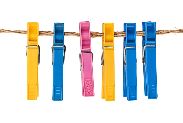 Multicolored plastic clothespins on a rope — Stock Photo, Image