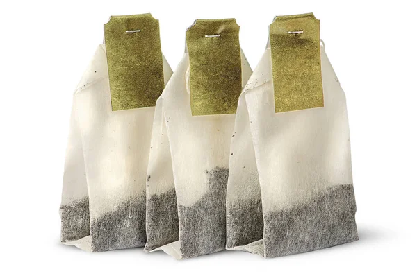 Three tea bags with labels — Stock Photo, Image