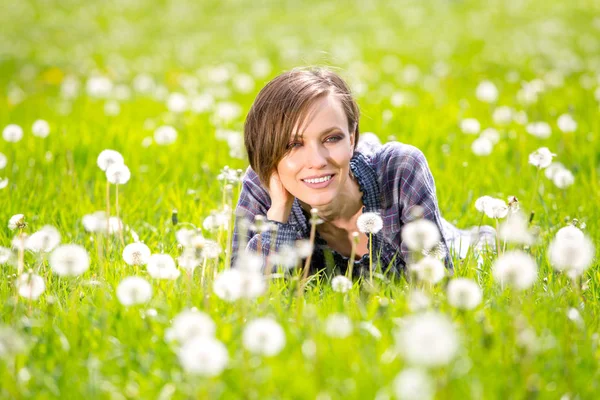 Happy spring woman on green nature Royalty Free Stock Images