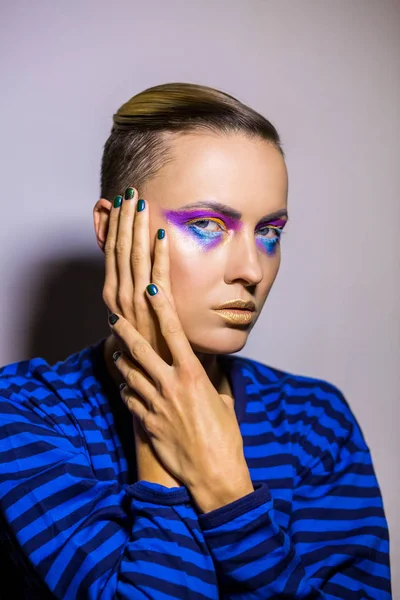 Pretty girl with unusual bright makeup and manicure design — Stock Photo, Image