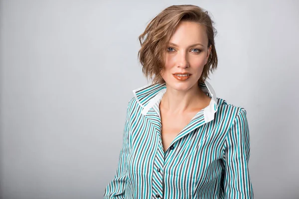 Office worker. Photo working woman in suit over grey background — Stock Photo, Image