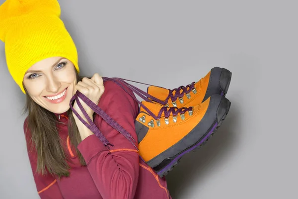 Young woman with autumn or winter trekking shoes — Stock Photo, Image