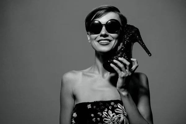 Portrait of young woman in black dress with heels — Stock Photo, Image