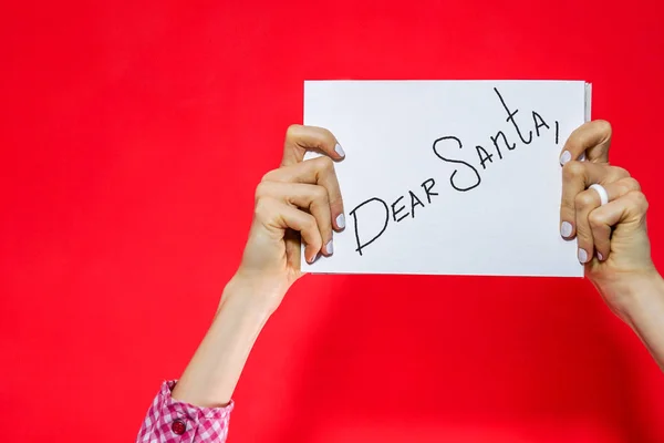 Dear Santa - letter to Santa Claus with copyspace over red background