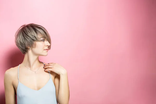 stock image fashion beautiful young woman with short hair over pink background