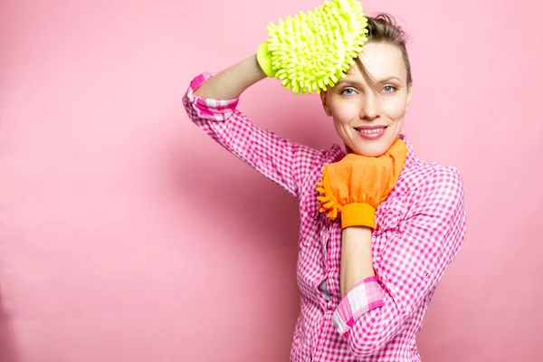 Spring cleaning concept. Funny woman with house supplies going to clean home