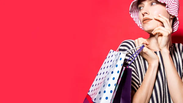 Happy Shopping Woman Shopping Bags Bright Red Background Wearing Striped — Stock Photo, Image