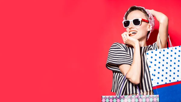 Happy Shopping Woman Shopping Bags Bright Red Background Wearing Striped — Stock Photo, Image