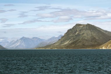 Mountains to the sea in Chukotka clipart