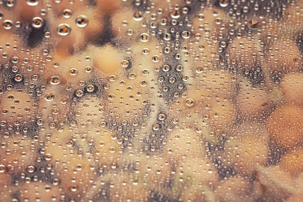 Gotas de água como um fundo de cor, close-up . — Fotografia de Stock