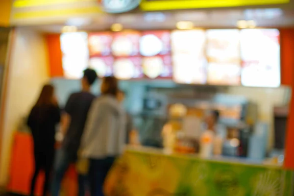 Arka plan resim insanlar sipariş yiyecek dükkanında bulanıklık