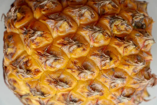 Close-up of skin of ripe pineapple. Fresh pineapple texture. Abs