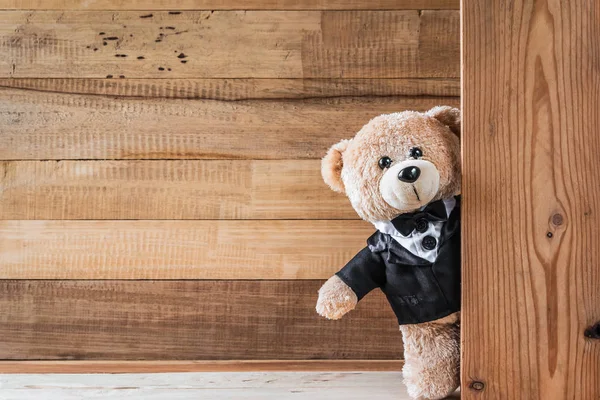 Teddy bear on old wood background — Stock Photo, Image