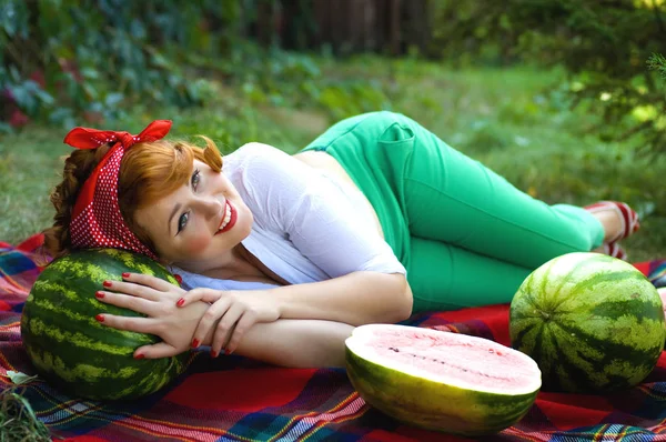 Horizontal photo of a pin-up girl with watermelons — Stockfoto