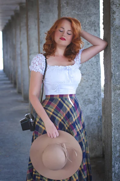 Vertical photo of a young red-haired european woman in retro pin — Stok fotoğraf