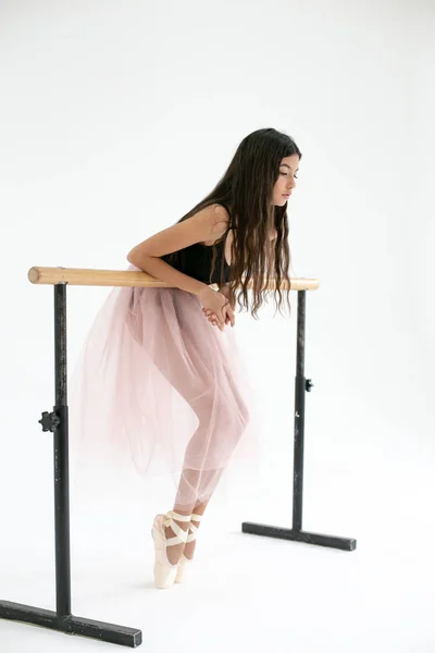 Vertical image of a young pretty ballerina with long dark hair n — Stock Photo, Image