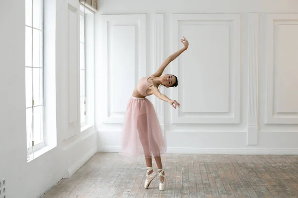 Horizontal photo of a young ballerina dancing in class — Stock Photo, Image