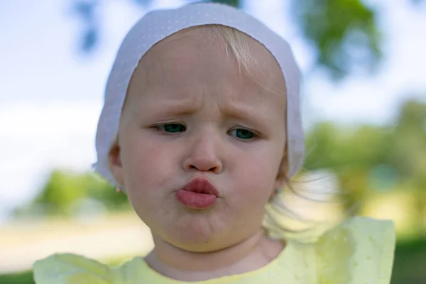 Horizontal close-up photo of a little girl who is upset about so — Stock Photo, Image