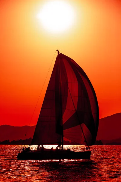 Yacht silhouette in the high sea on sunset — Stock Photo, Image