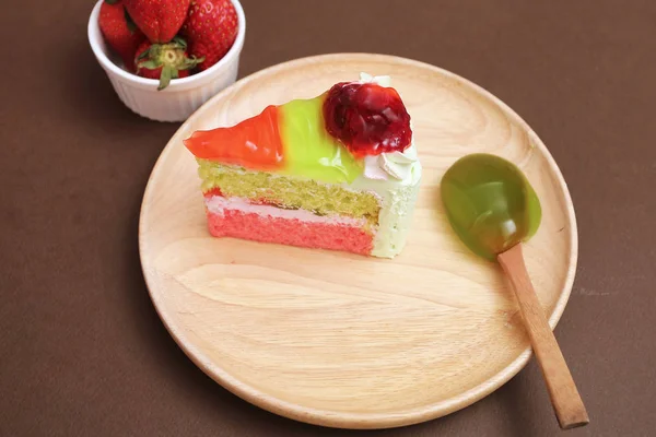 Piece of cake and strawberry kiwi jam topping — Stock Photo, Image