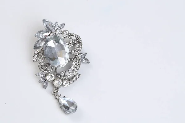 Brooch with silver flowers and jewellry — Stock Photo, Image