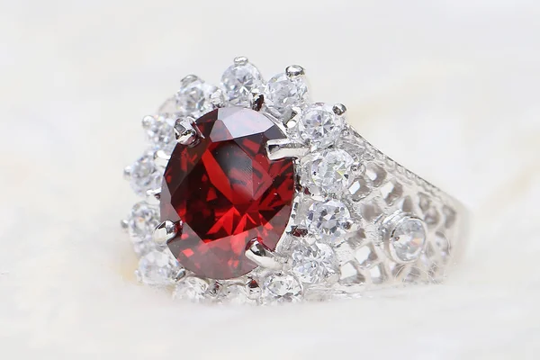 Red gemstone on diamond ring — Stock Photo, Image