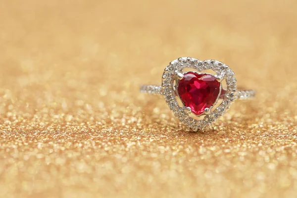 Red gemstone on diamond ring — Stock Photo, Image