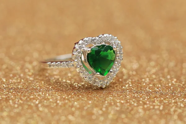 Heart green gemstone on diamond ring