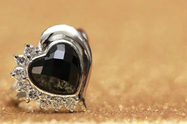 diamond ring and black gemstone