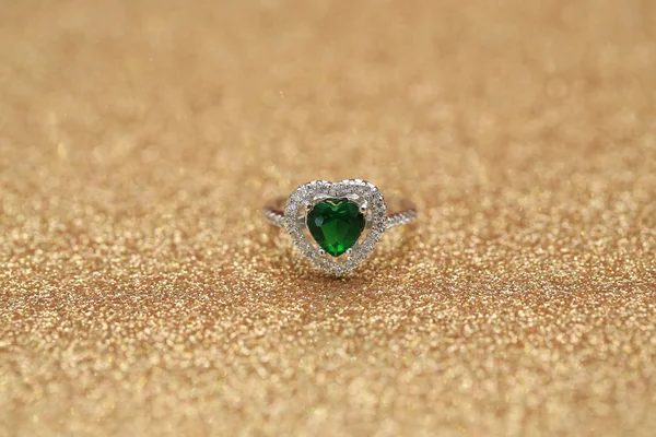 Heart green gemstone on diamond ring