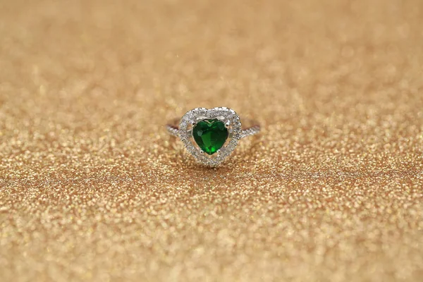 Heart green gemstone on diamond ring